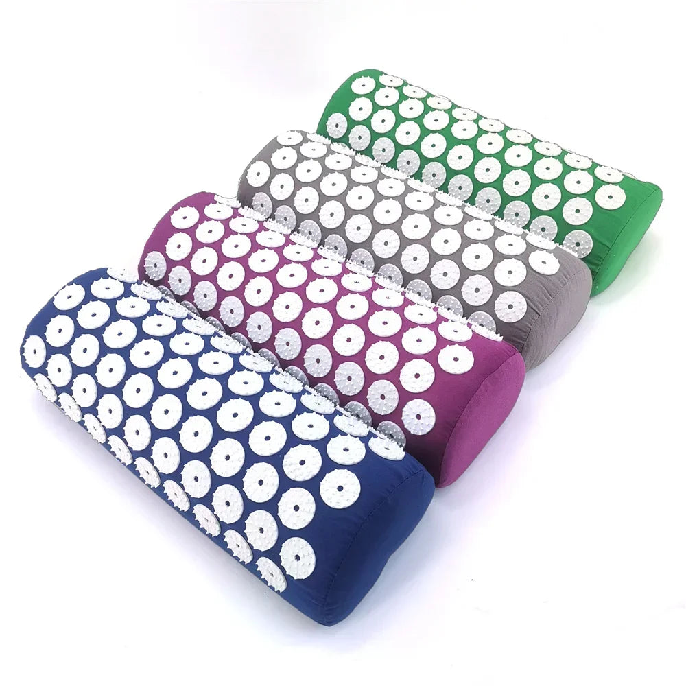 Acupressure mat and pillow set in use on the floor